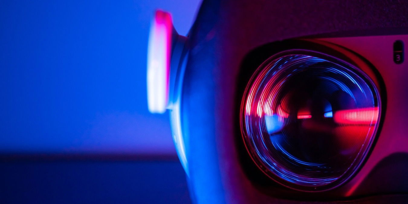 Close up of a VR headset against a blue background