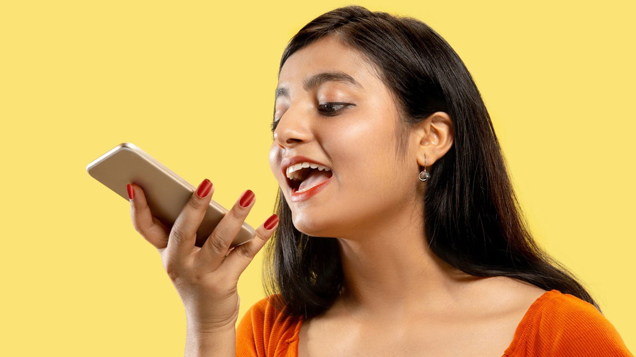 Portrait Of Beautiful Woman Isolated On Yellow Studio Background