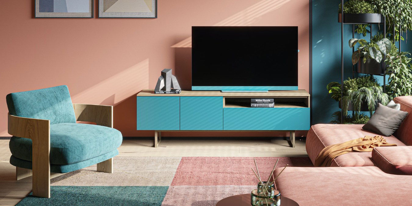 Living room TV setup with blue and pink themed furniture