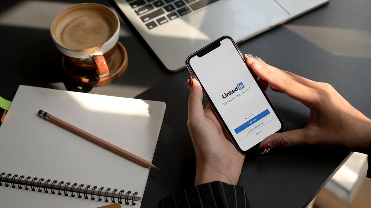 Chiang Mai, Thailand February 1, 2020 : Female Using Iphone With Linkedin Screen. Linkedin Helps Look For A New Job