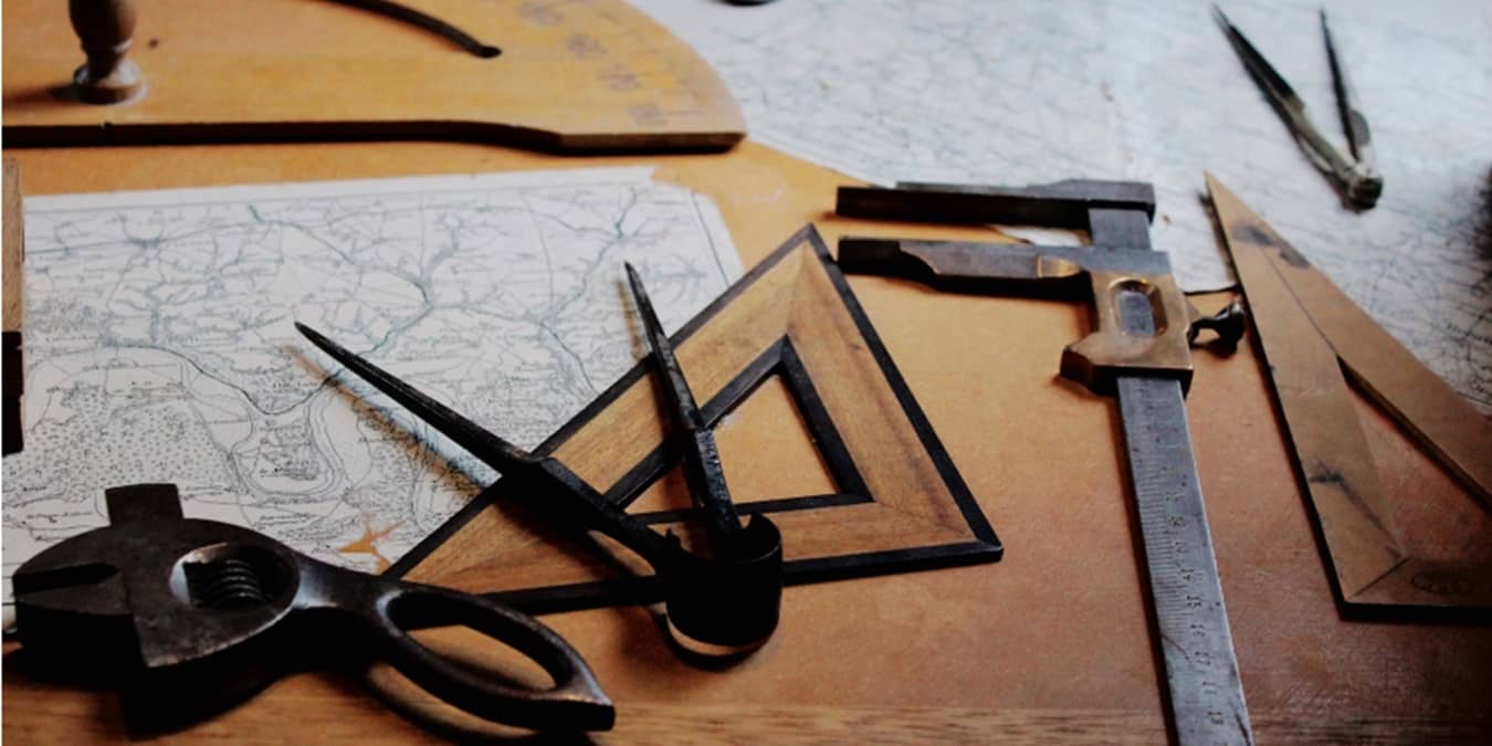 Distance measuring tools on a table with map.