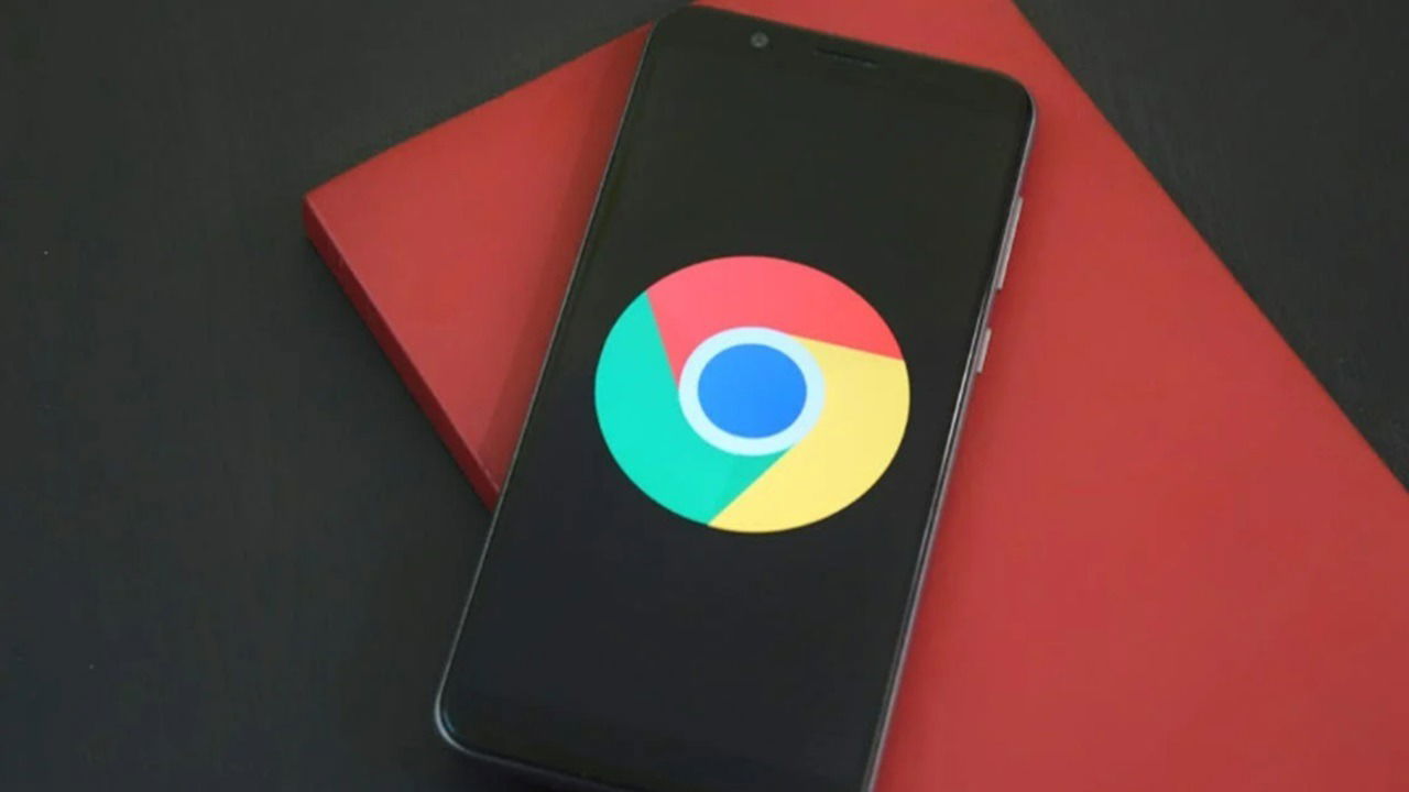 Chrome logo on an Android phone on a desk.