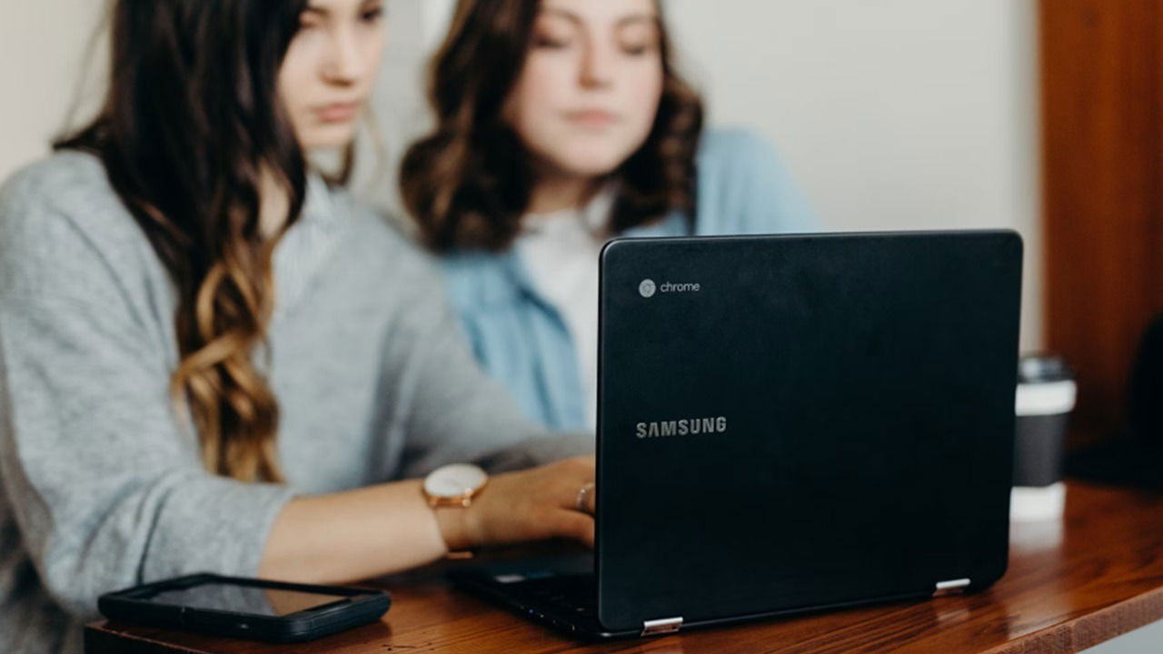 Two women using a Samsung Chromebook