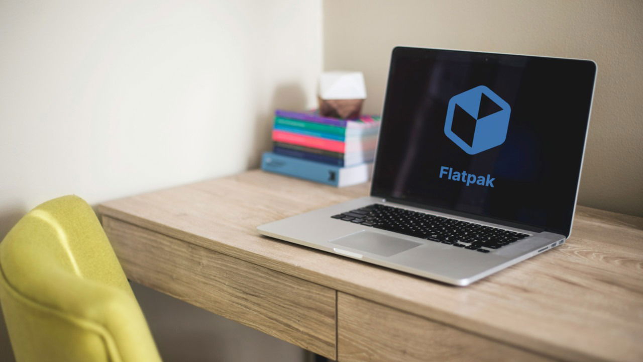 A photograph of a laptop on top of a wooden table.