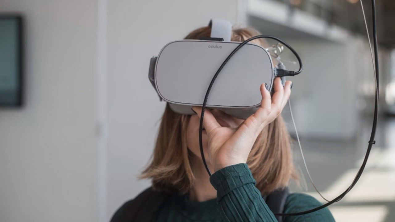 Woman wearing Oculus VR headset.