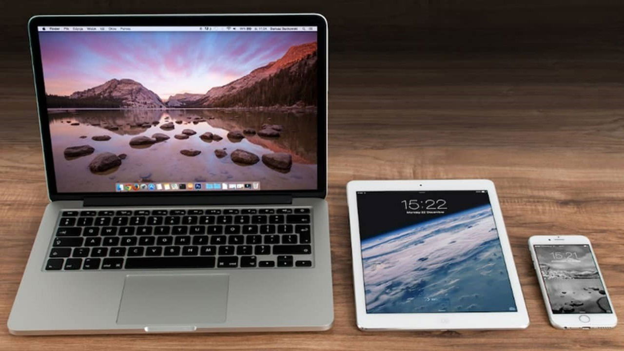 A laptop, tablet, and smartphone sitting side by side.