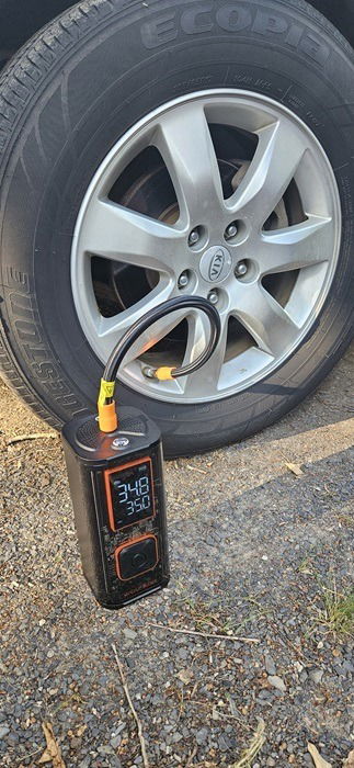 Inflating an SUV tire.