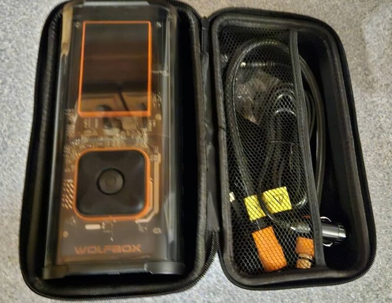 Hardshell case for portable tire inflator with accessories.